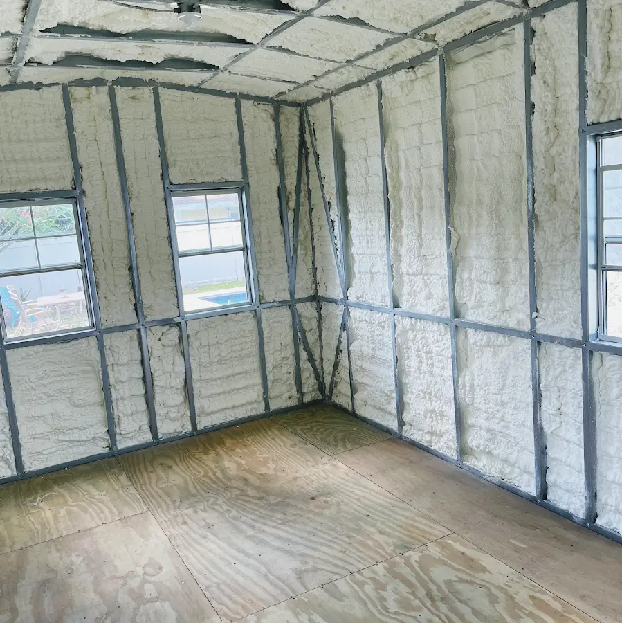 Closed-cell spray foam insulation applied to wall cavities in a residential project in Mineola